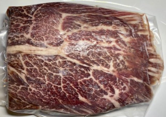 american wagyu flat iron steak on white plate