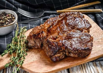 wagyu chuck eye steak grilled on a cutting board