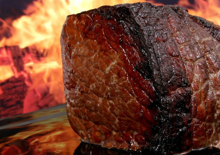 rump roast cooked over fire