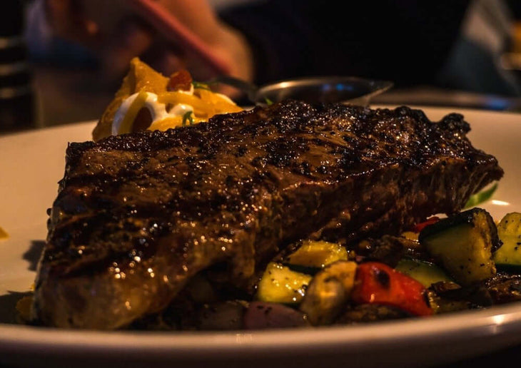 new york strip cooked plate